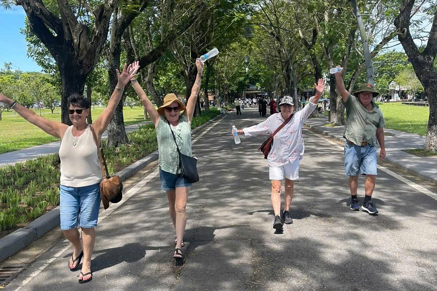 Happy guests exploring the Hue Imperial City with a local guide
