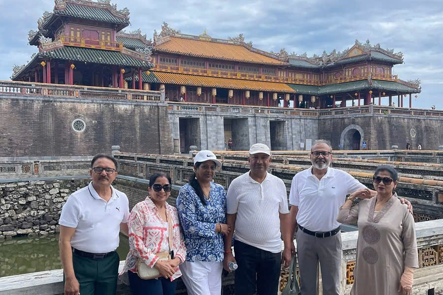 Happy guests in front of the Noon Gate at Hue Imperial City