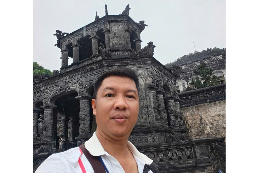 Viet Nguyen at the Stele Pavilion of Khai Dinh Tomb in Hue
