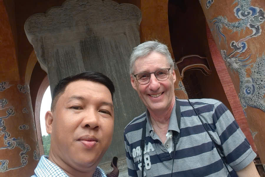 Viet Nguyen with guests at the Stele Pavilion of Tu Duc Tomb in Hue