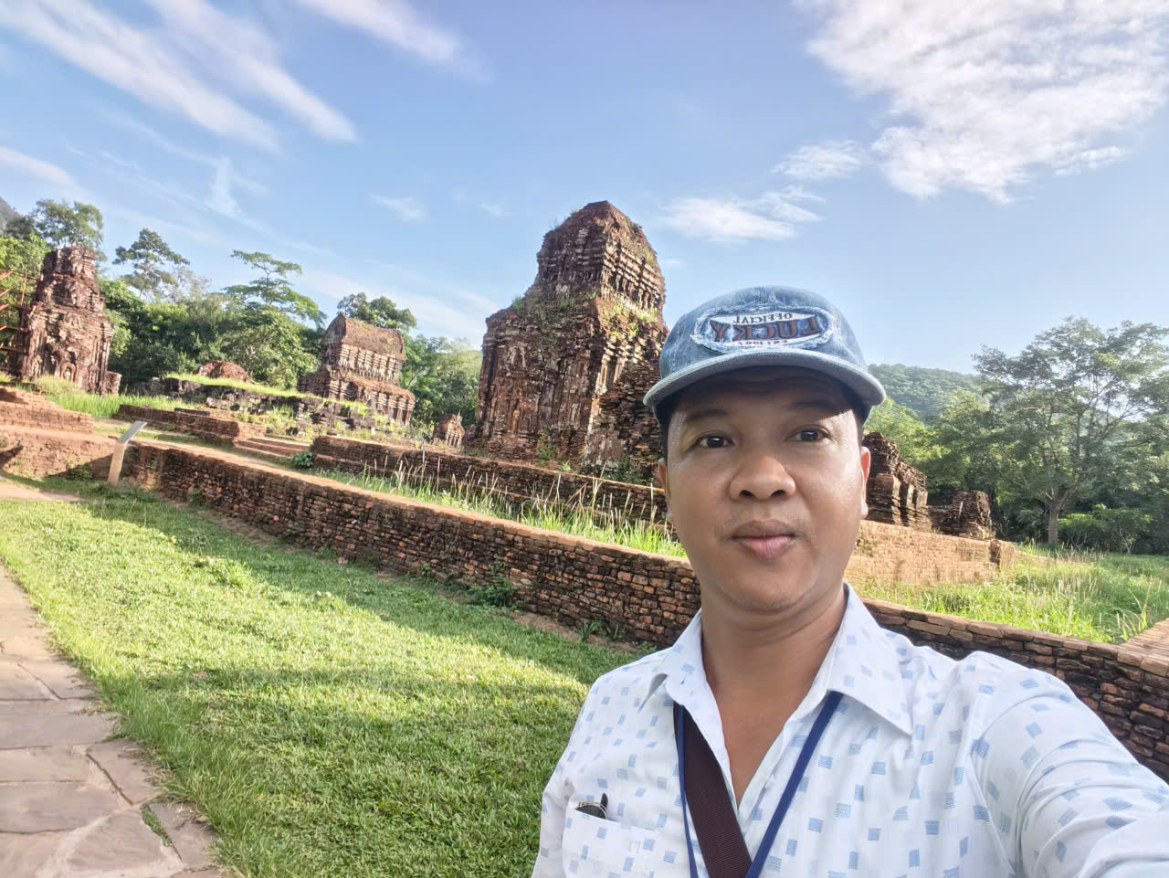 Viet Nguyen taking a selfie at ancient Hindu temple ruins during a half-day My Son Sanctuary tour from Hoi An
