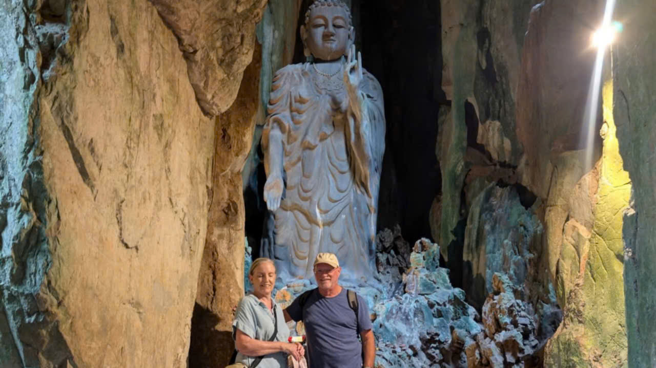 Family exploring Tang Chon Cave at Marble Mountains on a private Hoi An day trip from Da Nang