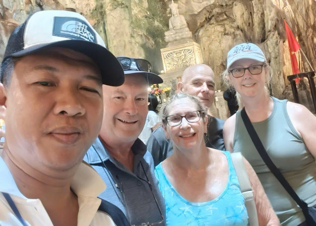 Viet Nguyen taking a selfie with guests during a private Marble Mountains and Ba Na Hills tour