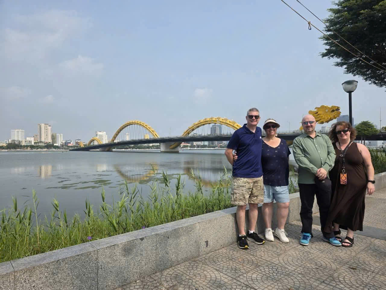Guests taking photos with Dragon Bridge in Da Nang before the famous weekend fire and water show.