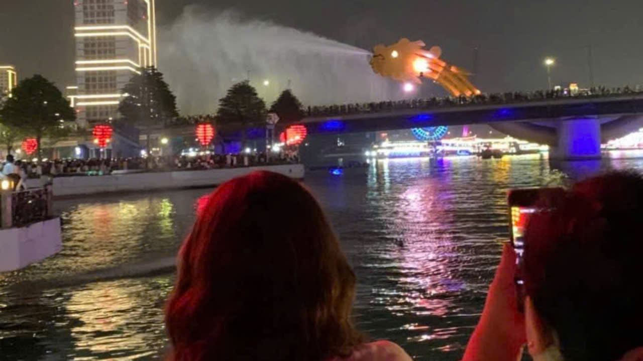 Dragon Bridge spraying water during the weekend night performance in Da Nang, Vietnam