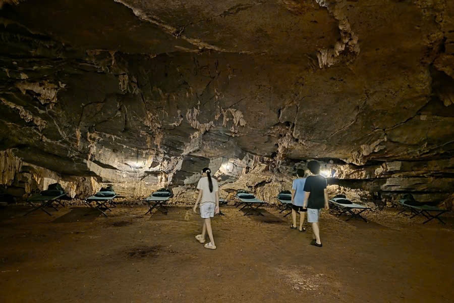 Tourists walking inside Commander Cave in Phong Nha