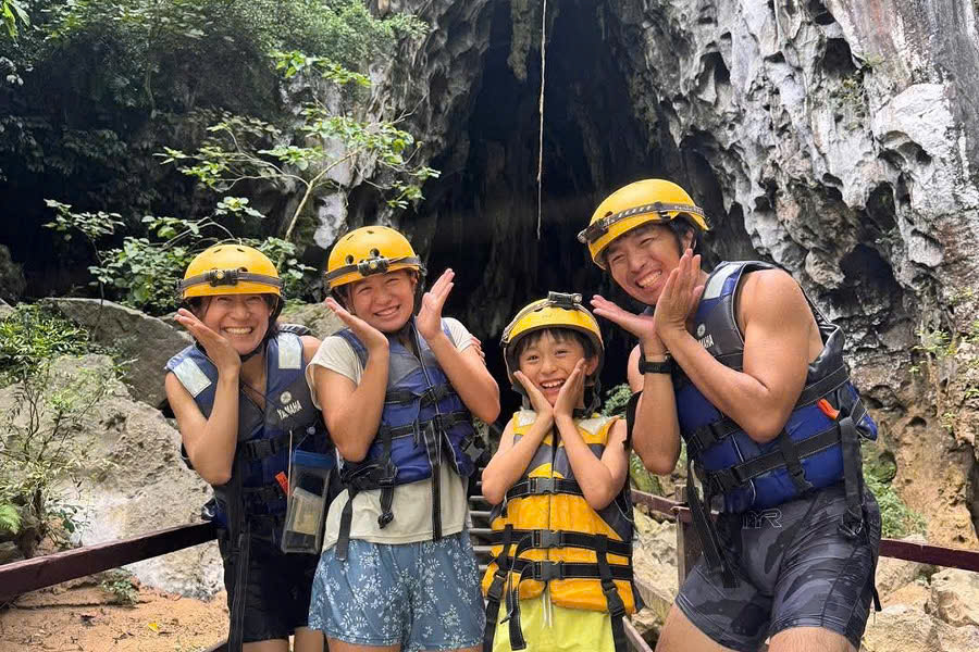 Tourists in front of the Dark Cave entrance in Phong Nha