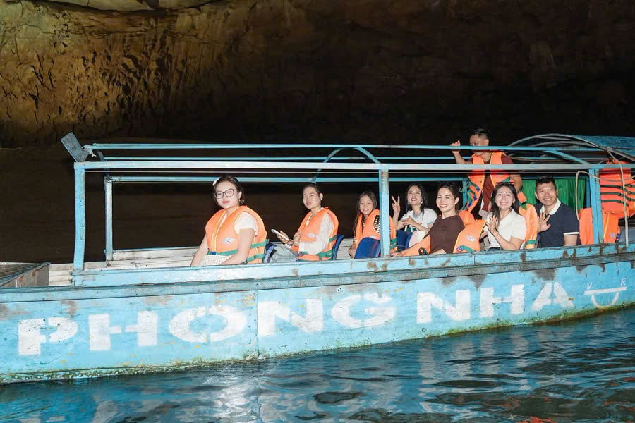Tourists taking a Son River boat cruise inside Phong Nha Cave
