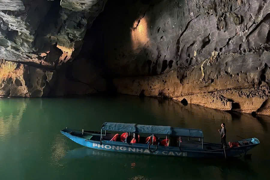 Boat carrying tourists inside Phong Nha Cave