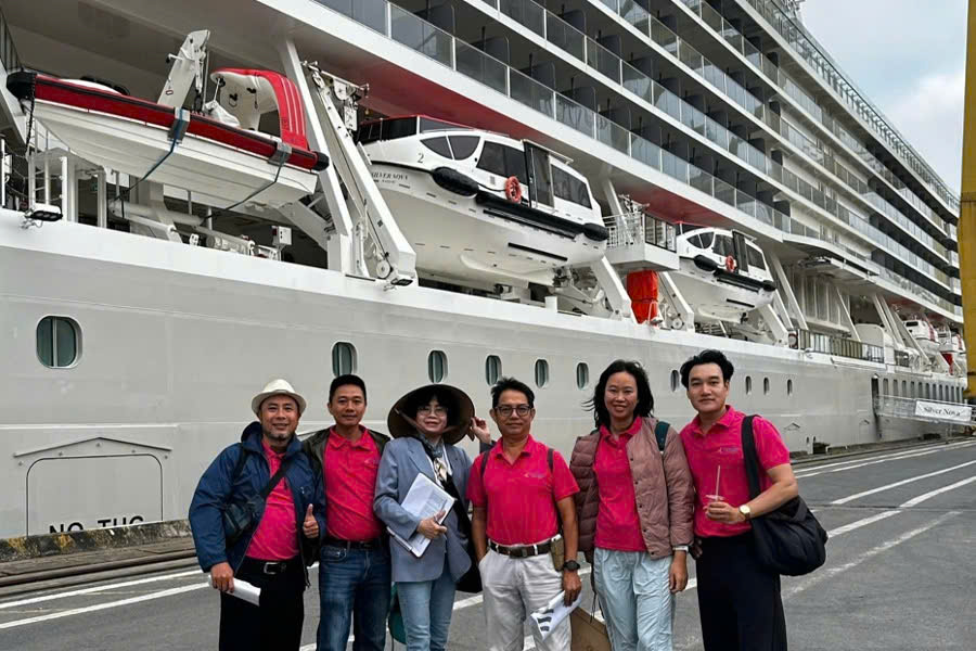 Tour guide taking a photo with a cruise ship at Phu My Port during a Phu My Port private tour.