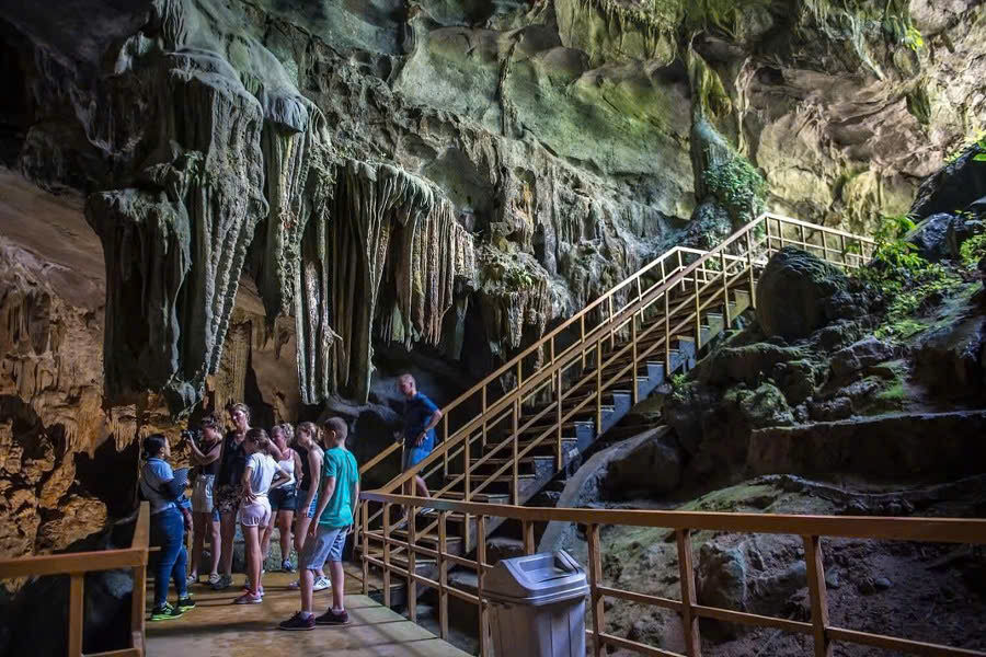 Tourist taking a photo inside Tien Son Cave in Phong Nha, Quang Binh