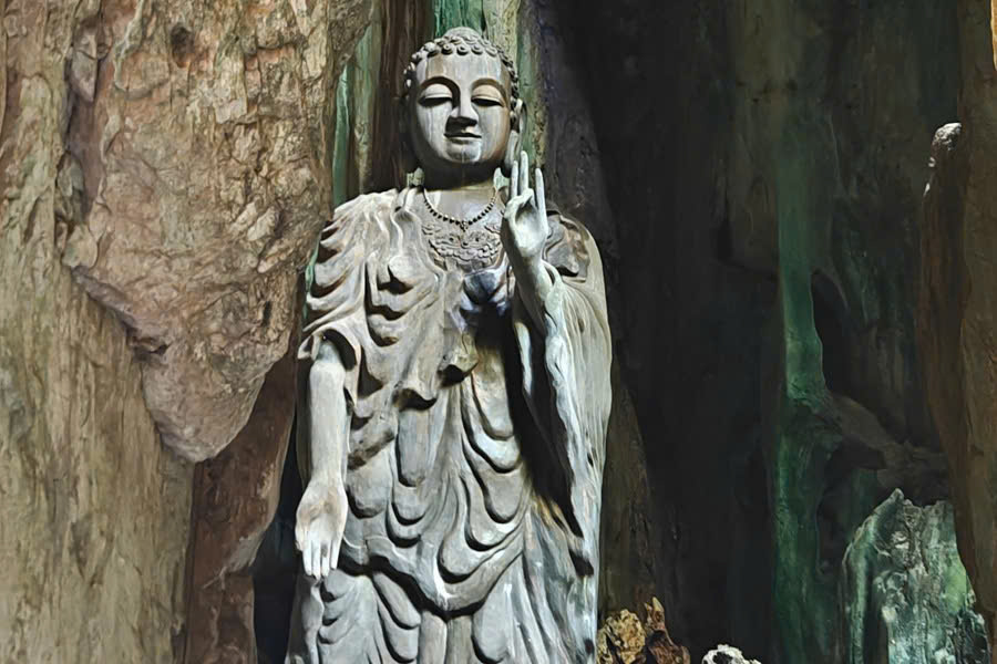 Buddhist statue inside Tang Chon Cave at Marble Mountains