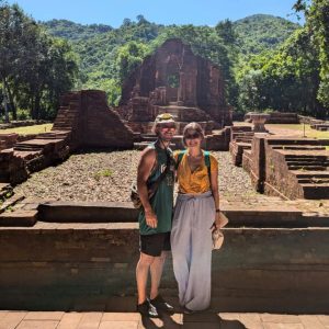 Guests taking photos in front of Group G temples during a My Son Sanctuary tour from Da Nang